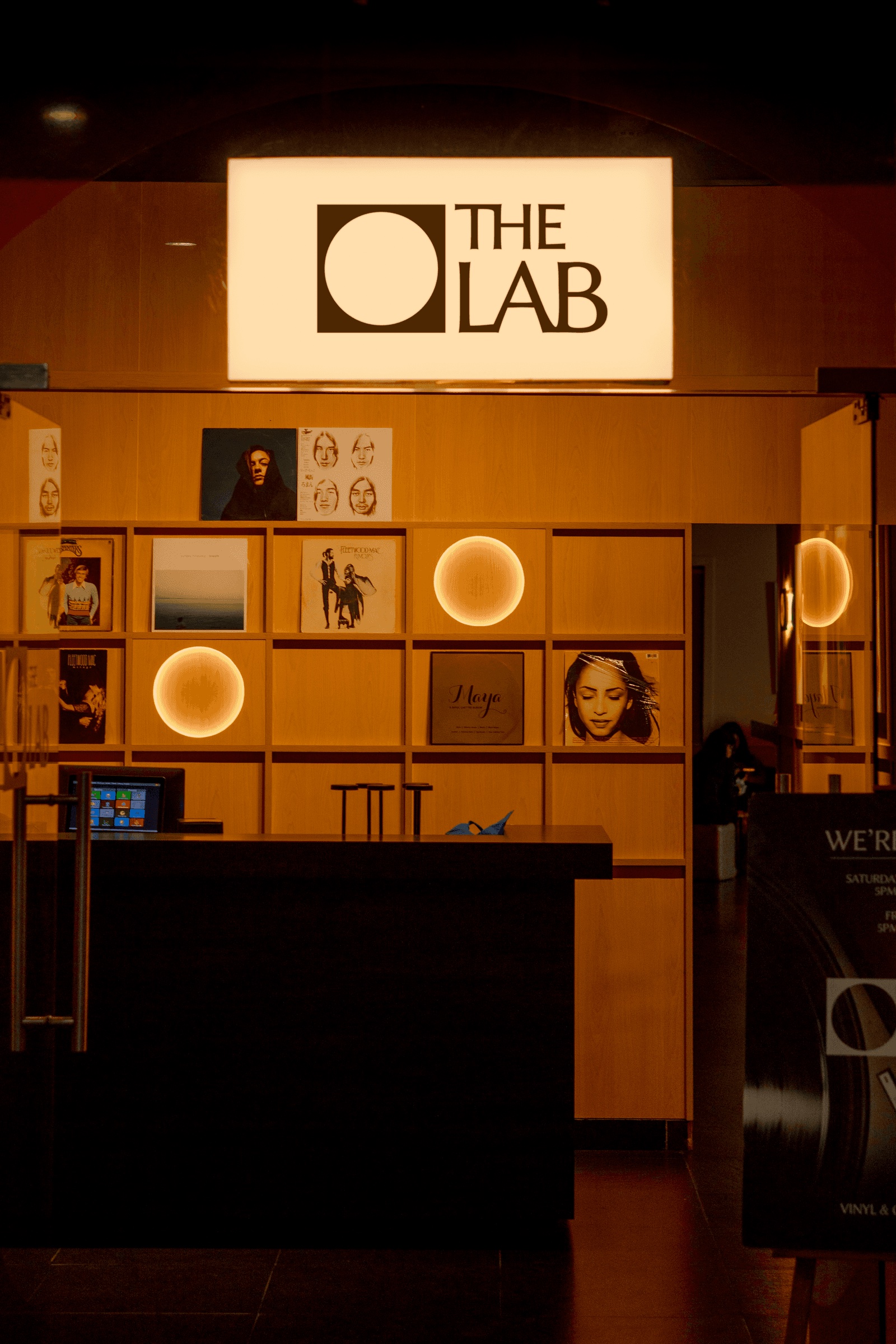 The Lab illuminated sign above the record shelves